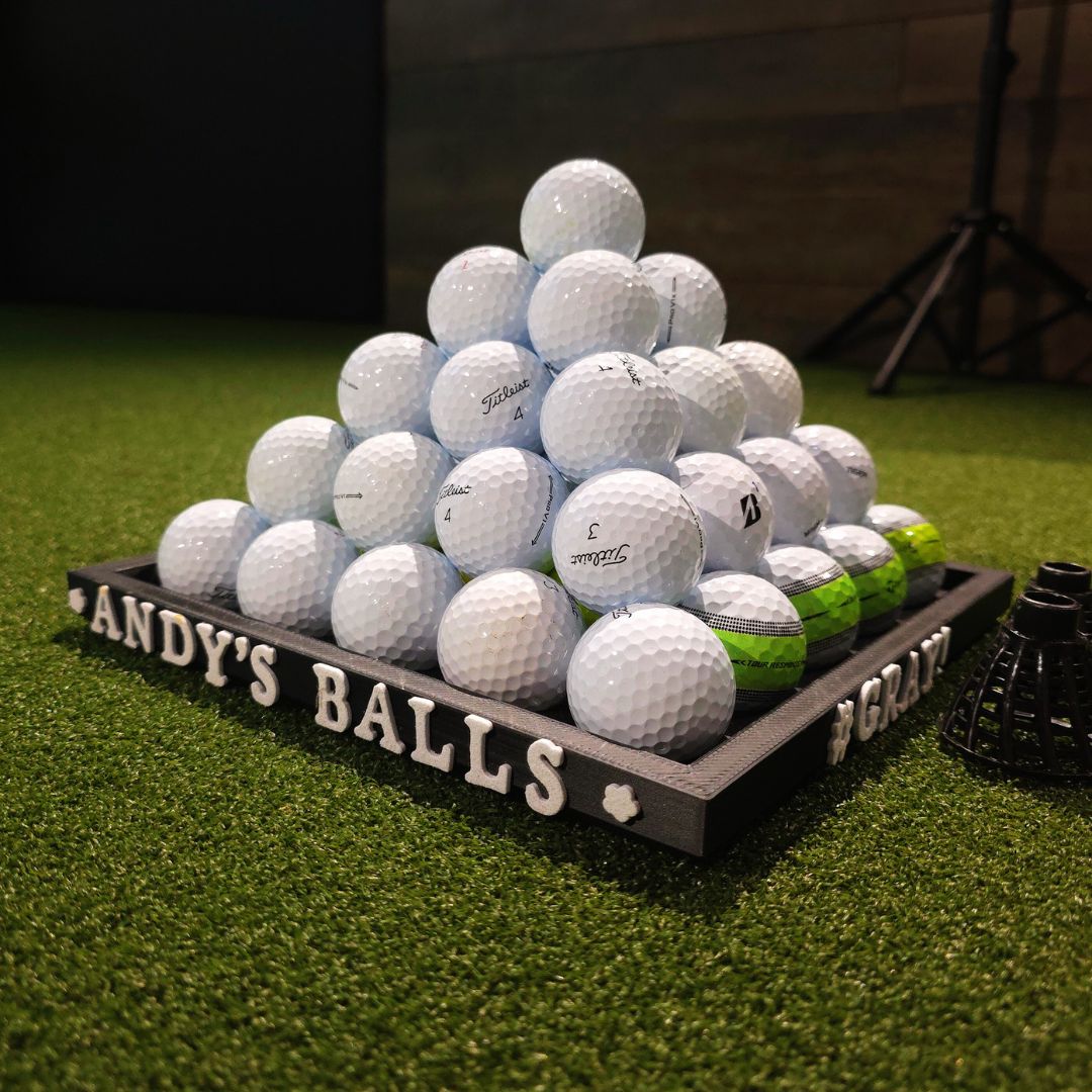 a pyramid of golf balls 