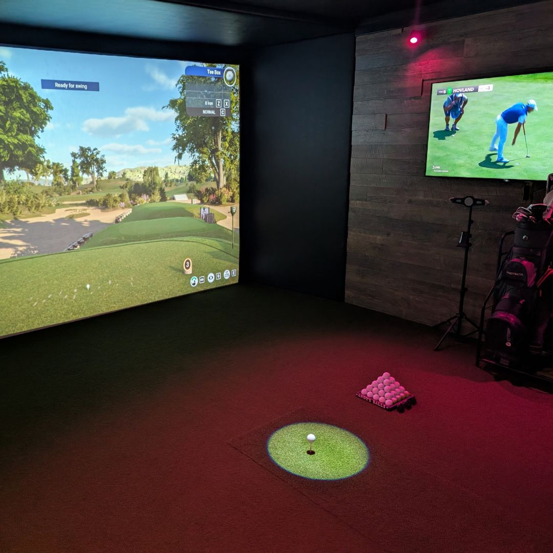 a wide shot of the garage to golf simulator conversion