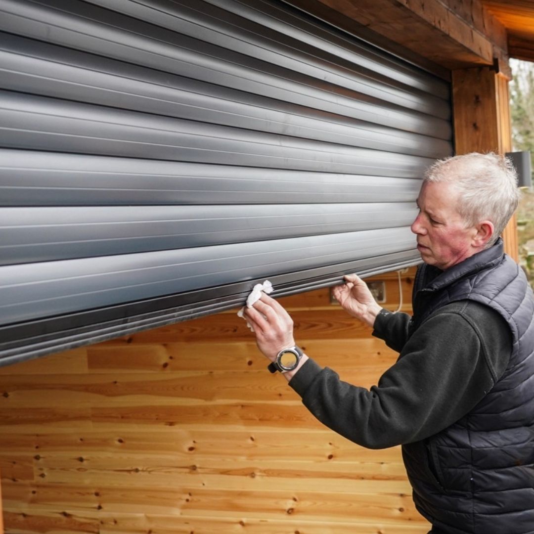 Garolla engineer Adrian installing a roller garage door