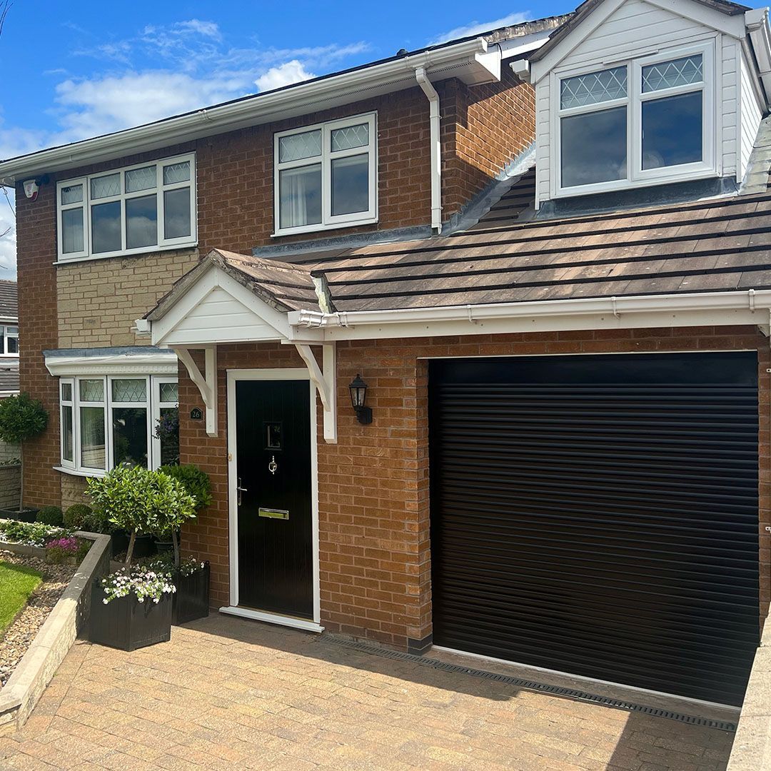 Garolla Transform 55mm black electric roller garage door in sunshine