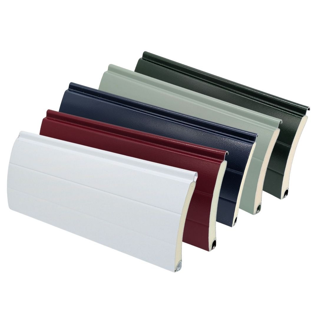 Range of insulated roller garage door slats displayed in different colours, including white, red, blue, grey, and green, showing available colour options.