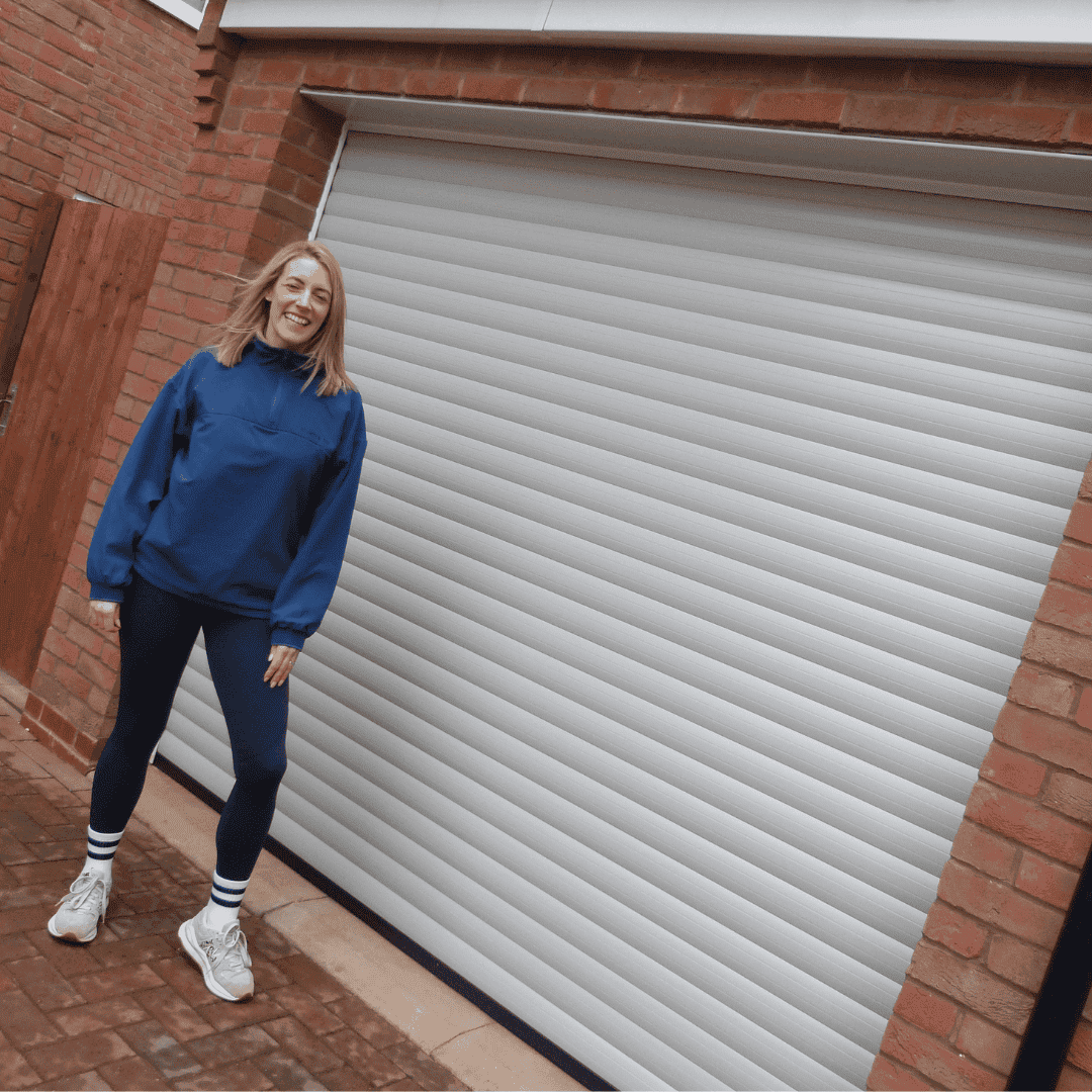 Emma Jones personal trainer in front of Garolla garage door