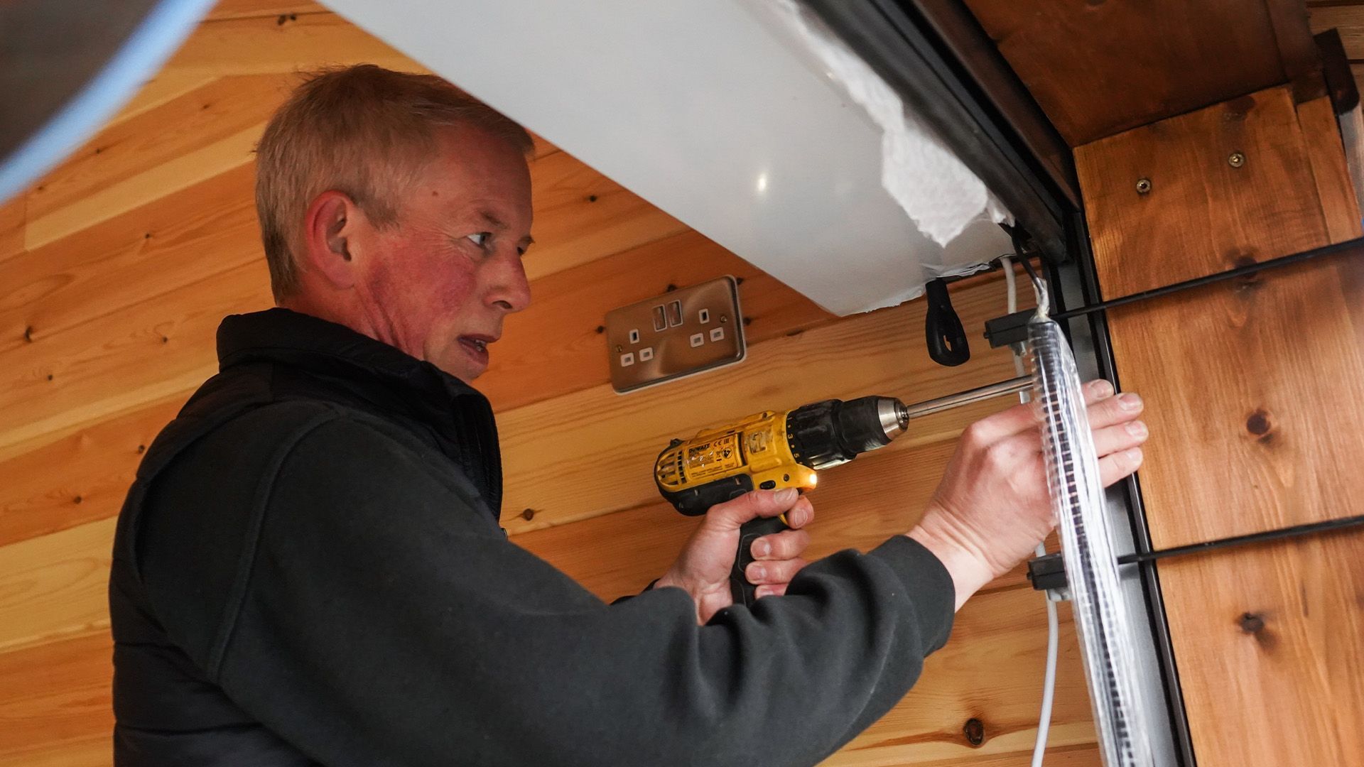 Engineer installing a Garolla electric garage door