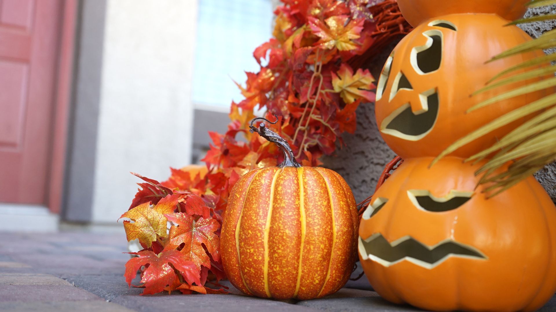 Halloween pumpkins outside a home