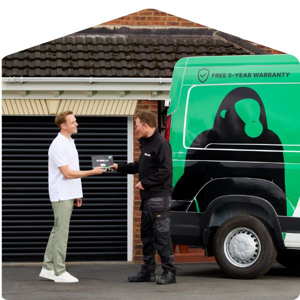 Garolla installer handing over garage door user manual to customer