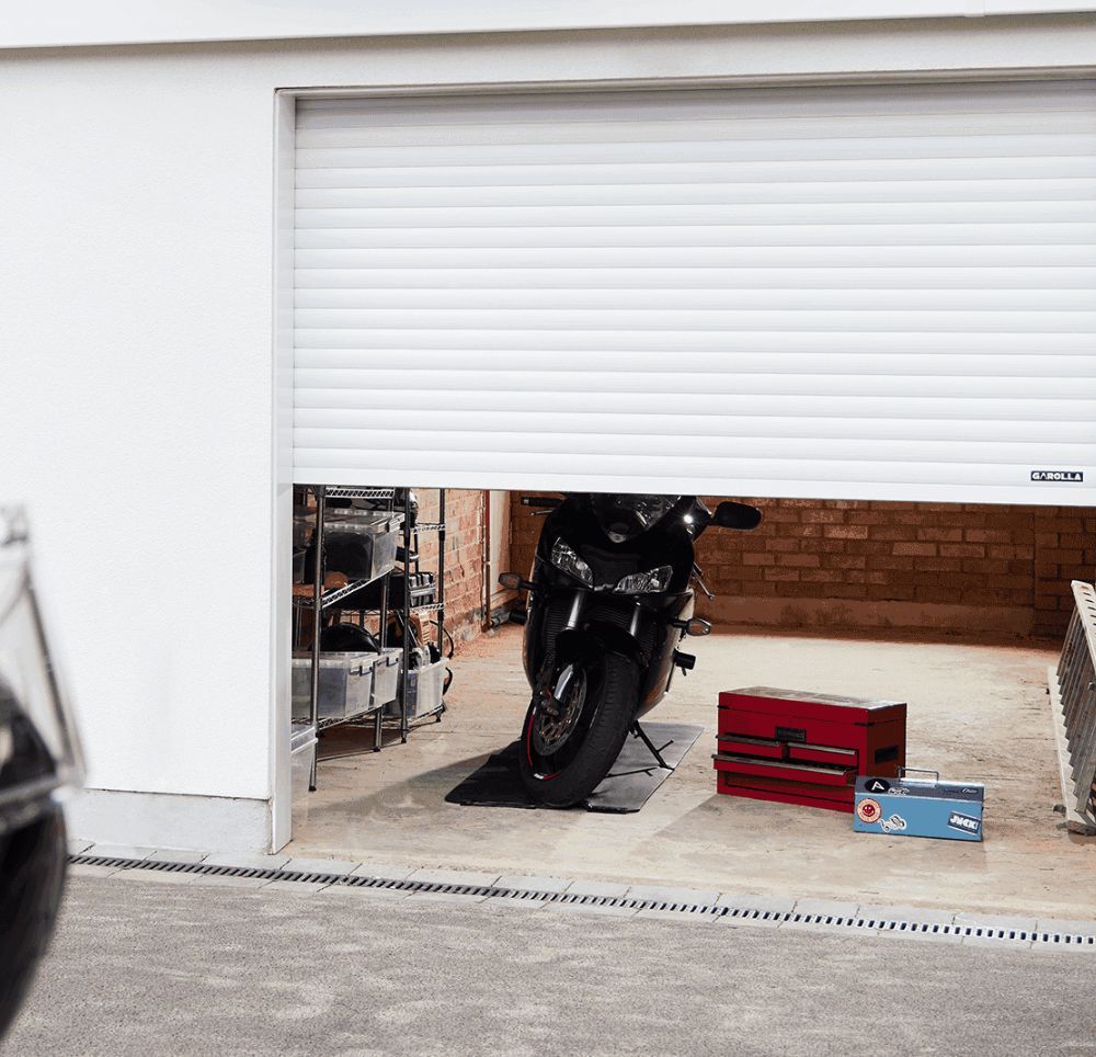 Garolla Transform roller garage door with motorbike