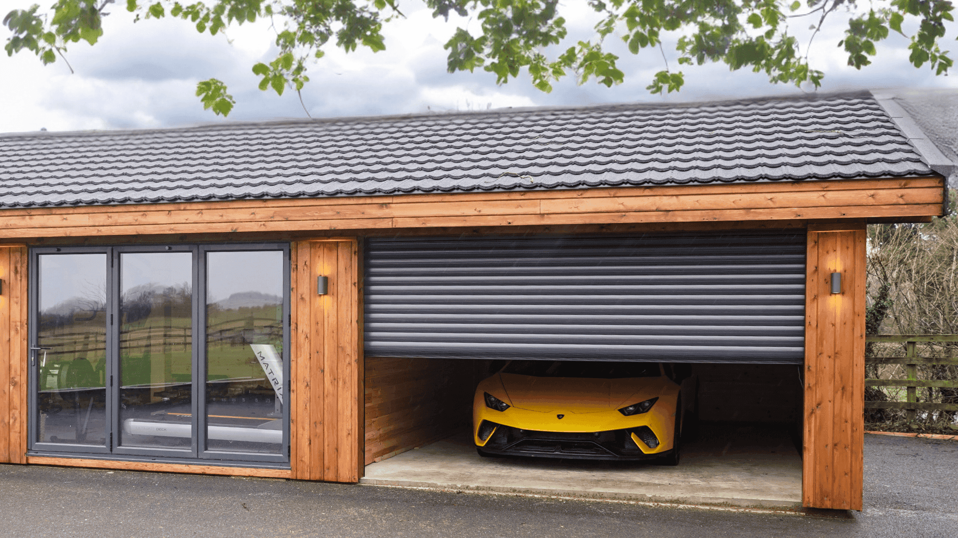 Garolla garage door half closed with yellow Lamborghini