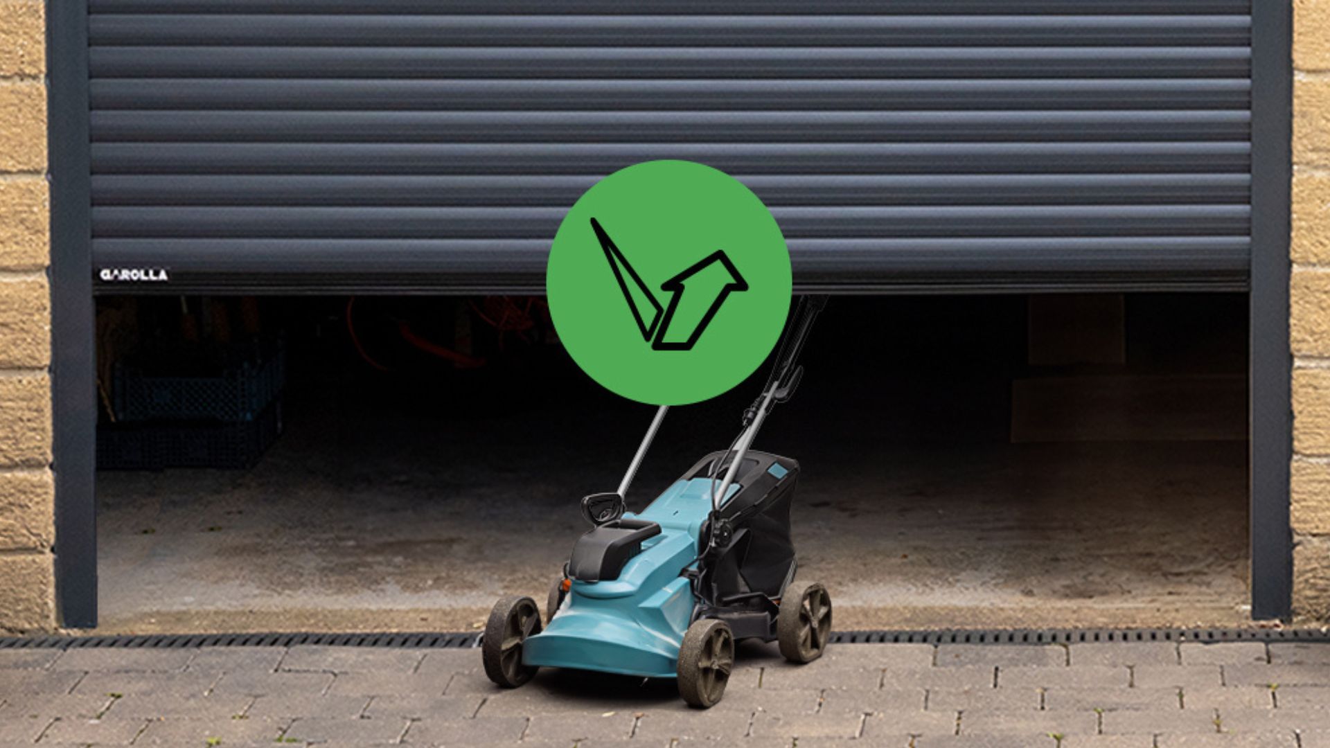 Garolla SafeGuard Plus protecting a lawnmower under a garage door