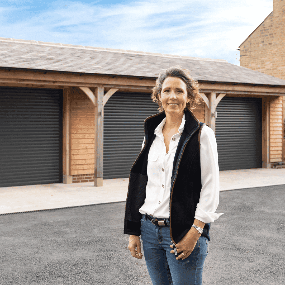 Satisfied customer in front of Garolla electric garage doors