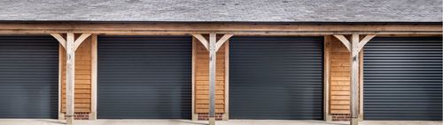 Triple roller garage doors