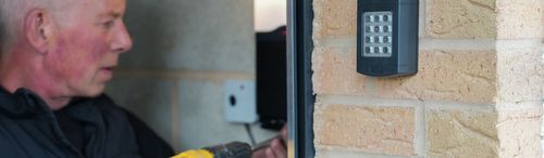 Garolla engineer installing a garage door