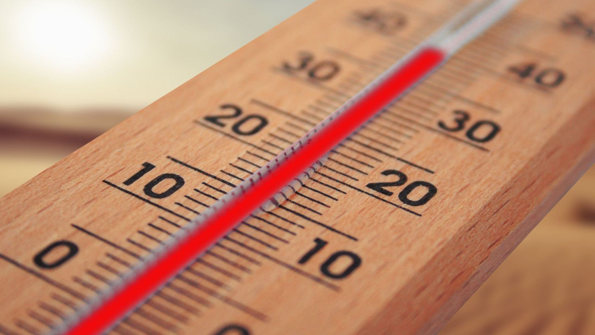 Wooden thermometer in summer